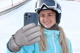 a woman using winter gloves