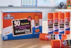 Elmer's glue sticks and box on table
