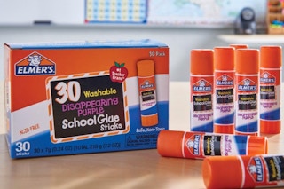 Elmer's glue sticks and box on table
