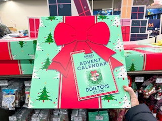 person holding a dog toy advent calendar