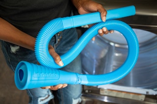 a hose cleaning a dryer vent