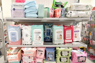 A store endcap with various brands facial wipes.
