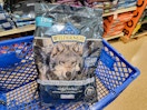 bag of dog food in a cart
