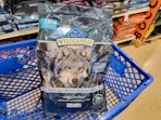 bag of dog food in a cart