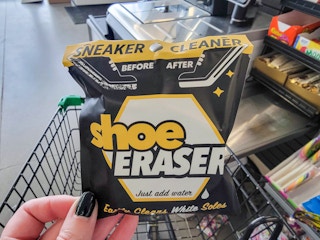hand holding a shoe eraser