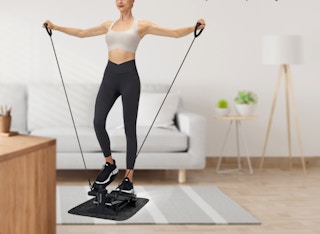 a woman exercising on a stepper machine