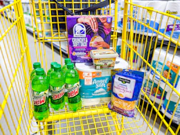 groceries in a yellow shopping cart