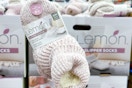 lemon cozy slipper socks held up at costco