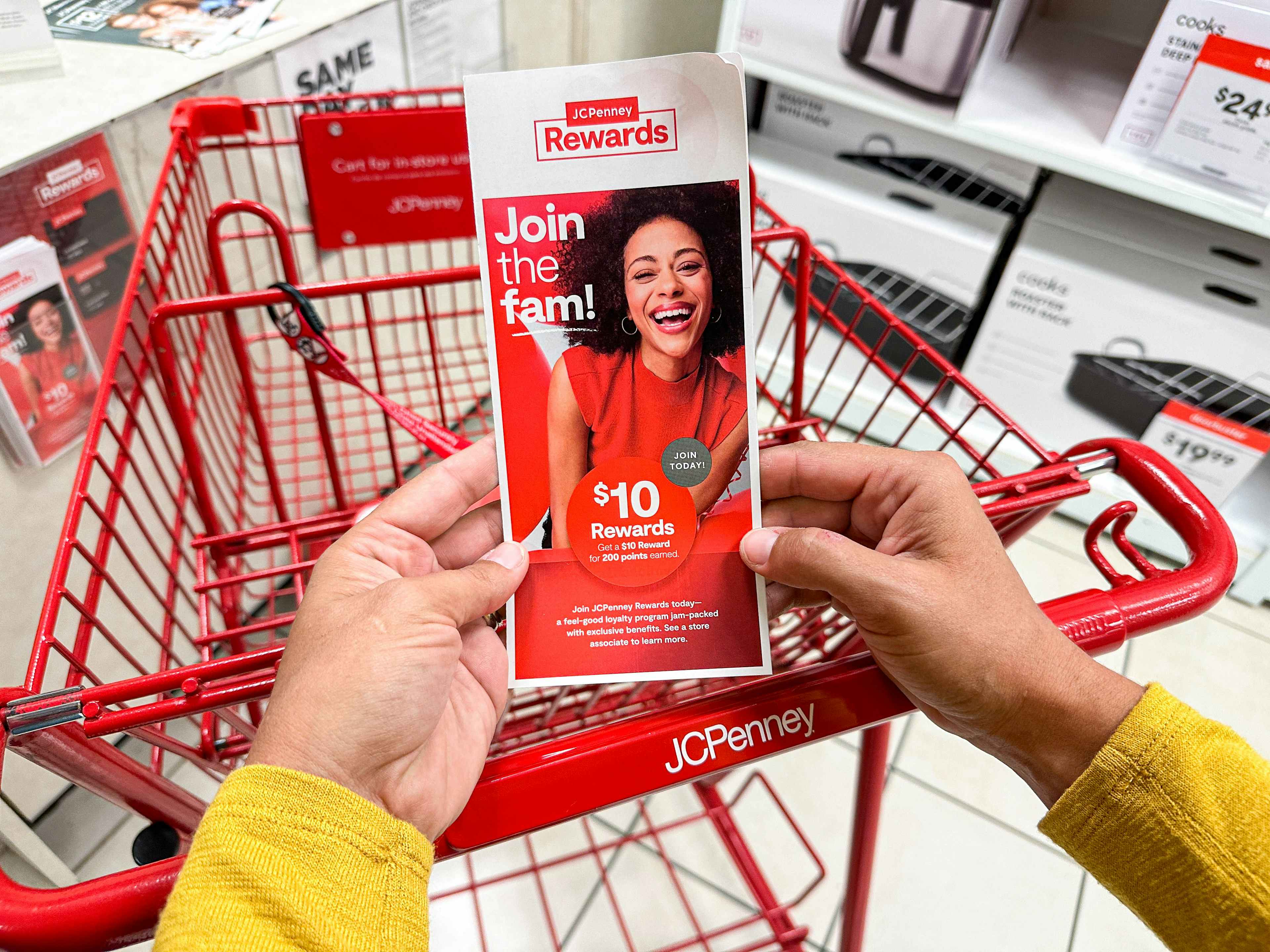 a jcpenney rewards flyer being held