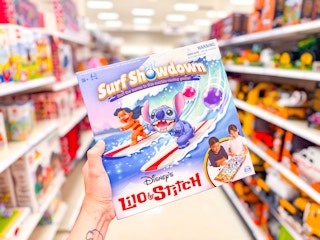 hand holding the Lilo & Stitch marble game
