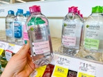 hand holding garnier micellar water in walgreens