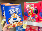 hand holding kellogg's cereal in walgreens