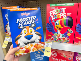 hand holding kellogg's cereal in walgreens