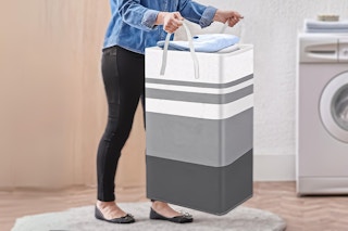 Large Hamper Basket being carried by a person in laundry room