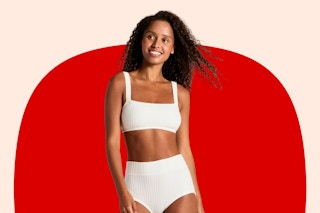 Model wearing a white Wild Fable Women's Sweater Rib Bra & Hot Pant Set