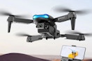 lifestyle image of a drone flying with a phone in the corner showing the camera footage