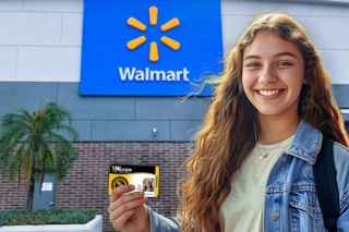 A college student holding a student id outside walmart 