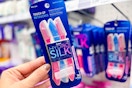hand holding a pack of schick hydro silk razors at target