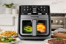 8-quart Gourmia air fryer on a kitchen counter surrounded by food