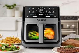 8-quart Gourmia air fryer on a kitchen counter surrounded by food