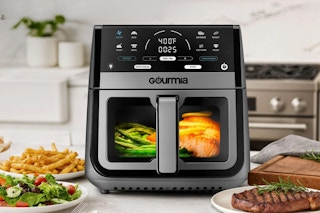 8-quart Gourmia air fryer on a kitchen counter surrounded by food
