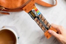 a woman holding a kind thins bar