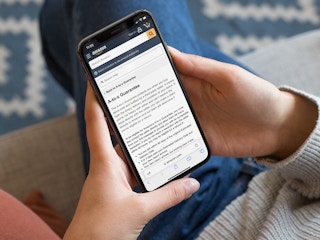 a person looking at amazons a to z guarantee on their iphone