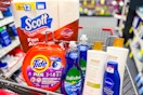 scott paper towels, tide pods, palmolive dish soap, raw sugar body wash, and nivea lotion in a cart