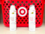 2 dove whole body deodorants sitting in front of a target basket