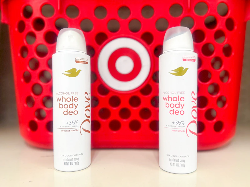 2 dove whole body deodorants sitting in front of a target basket