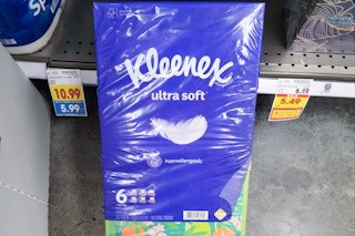 hand holding kleenex tissue bundle at kroger