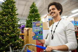 a person in Sam's Club with the black friday ad