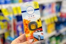 hand holding a febreze car vent clip