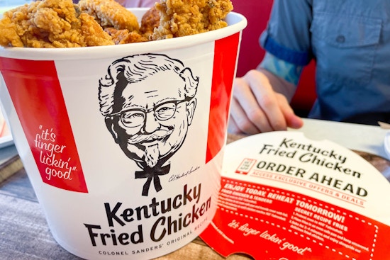 open bucket of kfc chicken on table