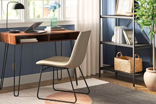 Lifestyle image of the Hairpin Writing Desk in a home setting near a window