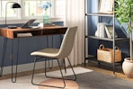 Lifestyle image of the Hairpin Writing Desk in a home setting near a window