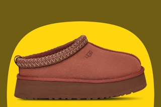 Ugg women’s slippers on a yellow and olive background. 