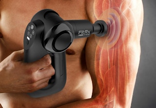 Lifestyle image of women holding a FitRX Massage Gun (backside view) over pink background