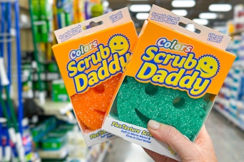 hand holding scrub daddy sponges