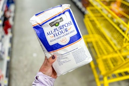 hand holding a bag of clover valley flour