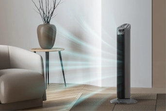 A tower fan blows air around a room