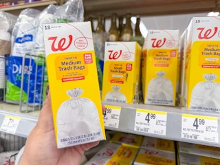 hand holding walgreens trash bag pack