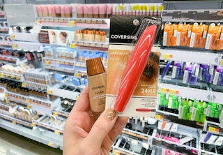 covergirl makeup held in front of makeup displays