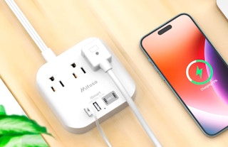 extension cord with a phone plugged into it