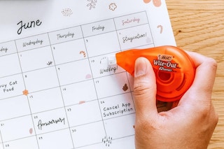 someone using Bic Wite-Out Correction Tape on a calendar