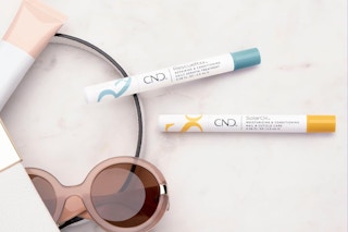 CND cuticle oil pens next to open bag