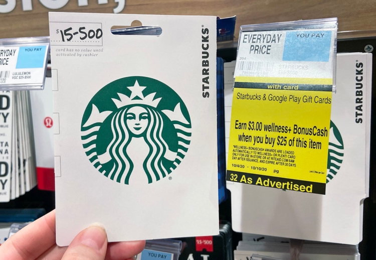 Rite Aid gift card promotion tag with a Starbucks gift card nearby
