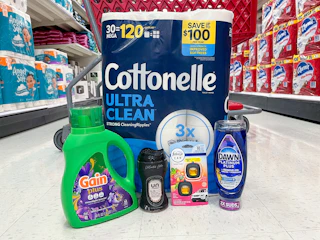 cottonelle, gain, dawn, downy, and febreze sitting in front a target cart