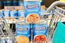 progresso soup cans stacked in shopping cart