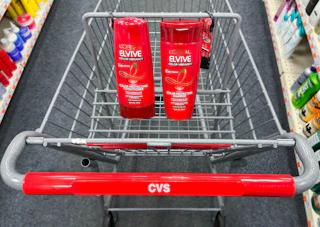 two bottles of L'Oreal Elvive shampoo and conditioner inside cart
